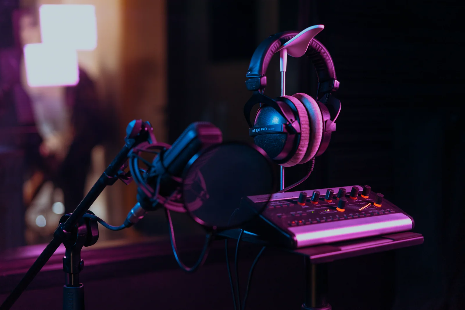 Studio microphone, headphones, and audio mixer